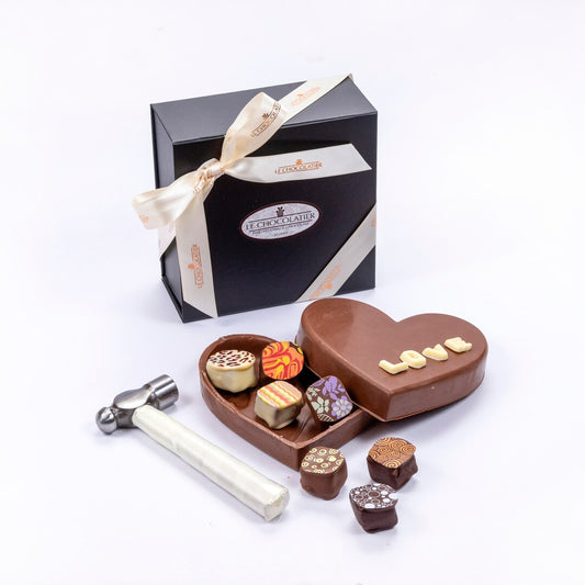 chocolate heart smash box with white chocolate letters on top that say "LOVE"