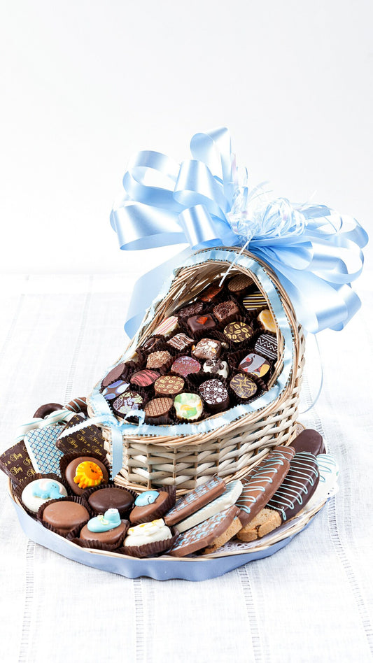 Wicker Bassinette Of Chocolates On Cookie Platter