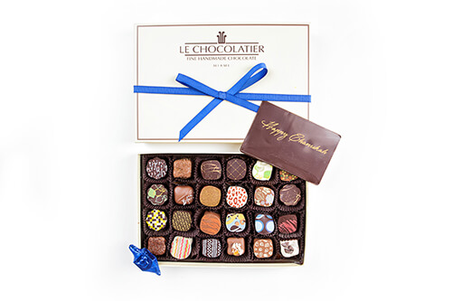 Box of 24 truffles. A chocolate plaque with Happy Chanukah & a foil wrapped chocolate "dreidel".